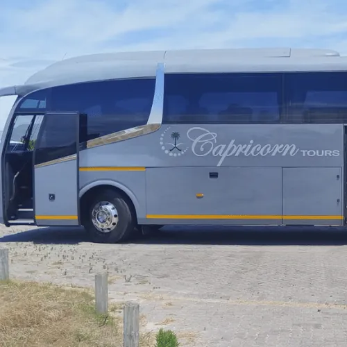The Irizar i6s in Capricorn Tours colours, with its door open