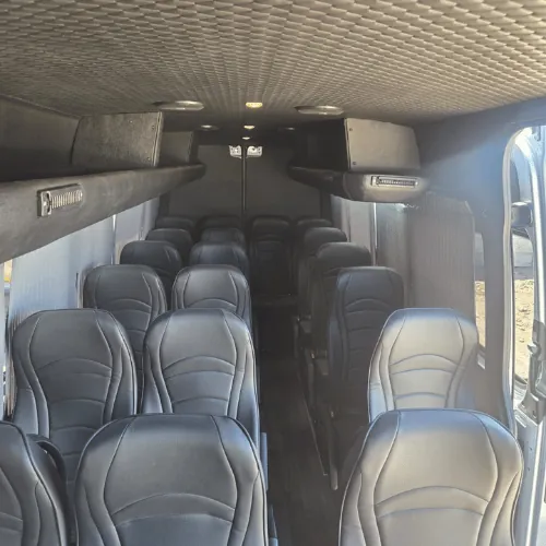 Leather seats inside the silver Mercedes Sprinter