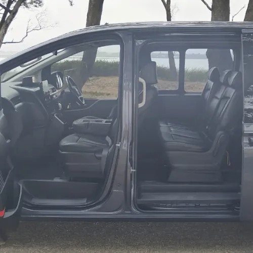 The grey Hyundai Staria with the sliding door open