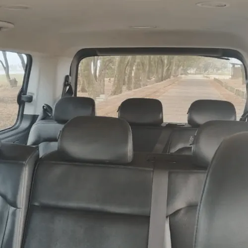 Rows of leather seats inside the grey Staria